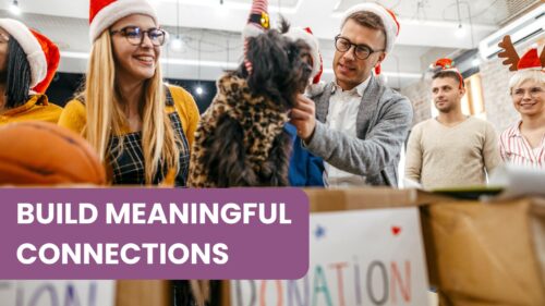 A festive group of five people, many wearing holiday-themed hats (like Santa hats and reindeer antlers), participates in a charity donation drive. The central figure is a man wearing glasses and a Santa hat, holding a small leopard-print dog above a box labeled "DONATION," capturing the spirit of building meaningful connections during the holidays for a nonprofit organization.